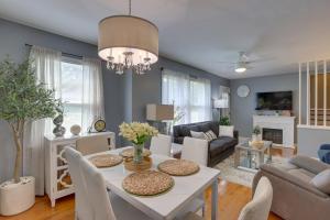 a living room with a white table and chairs at Modern Birmingham Escape with Yard and Fire Pit! in Birmingham