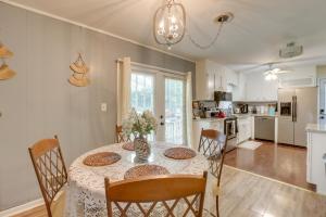 a kitchen and dining room with a table and chairs at Modern Birmingham Escape with Yard and Fire Pit! in Birmingham