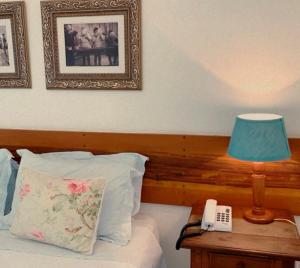 Postel nebo postele na pokoji v ubytování Hotel Vila Nova do Príncipe