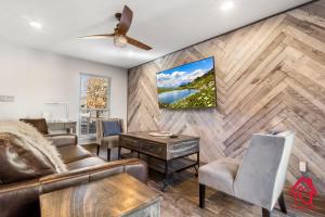 a living room with a couch and a table at The Plaza - An Irvie Home w Summer Pool in Albuquerque