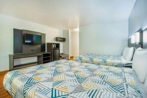 Rúm í herbergi á Motel 6-Gresham, OR - Portland