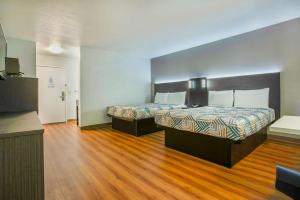 Rúm í herbergi á Motel 6-Gresham, OR - Portland