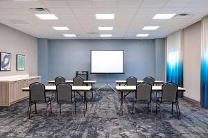 a conference room with tables and chairs and a white screen at Homewood Suites By Hilton Santa Clarita/Valencia, Ca in Santa Clarita +37 photos
