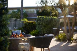 a table with two chairs and a fire pit at The Leta Santa Barbara Goleta, Tapestry Collection by Hilton in Santa Barbara