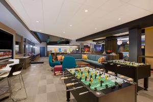 a lobby with a chess board on a table at Tru By Hilton Traverse City in Traverse City