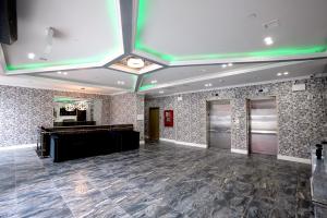 a large room with a piano and a dance floor at Hotel Liberty Inn & Suites-JFK Airport- La Guardia Airport in Queens