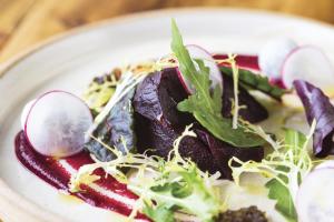 a plate of food with vegetables on a table at The Old Stocks Inn in Stow on the Wold