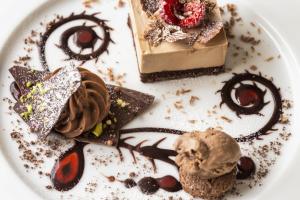 a plate of desserts on a white plate at The Old Stocks Inn in Stow on the Wold