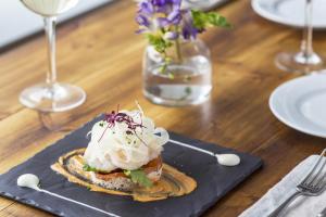 a plate of food with ice cream on a table at The Old Stocks Inn in Stow on the Wold