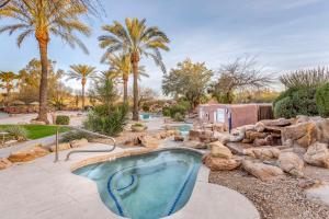 a swimming pool in a yard with rocks and trees at Hilton Vacation Club Rancho Manana in Cave Creek