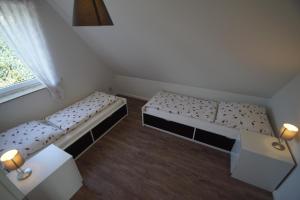 En eller flere senge i et værelse på Lisbeth