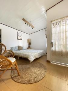 a bedroom with a bed and a table at Hat De homestay in Xuan An