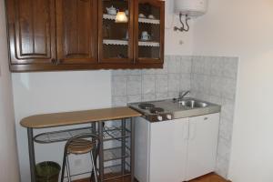 Kuchyň nebo kuchyňský kout v ubytování Apartments Petrada