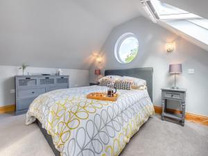 a bedroom with a large bed and a window at The Retreat - Uk45099 in Kirklington