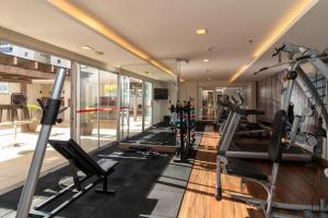a gym with treadmills and cardio equipment in a building at S4 Hotel Águas Claras Brasília Flat particular fora do pool in Brasilia