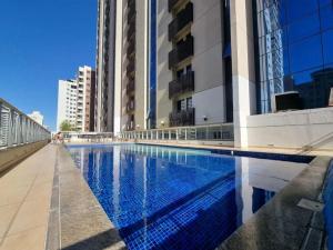 a swimming pool in the middle of a building at S4 Hotel Águas Claras Brasília Flat particular fora do pool in Brasilia