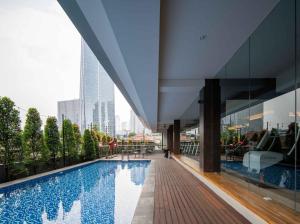 a view of a building with a swimming pool at Cove The Day in Jakarta