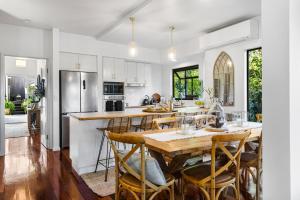 a kitchen with a large wooden table and chairs at Fig Tree Nest in Montville