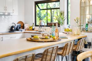 a kitchen with a counter with a tray of food on it at Fig Tree Nest in Montville