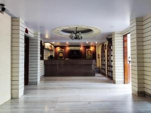 a hallway of a building with a chandelier at KANCHAN DEEP in Jaipur