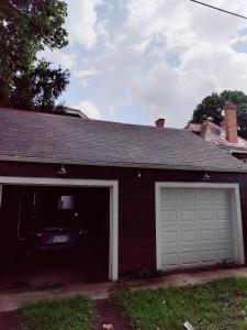 a garage with a car parked inside of it at Downtown Retreat - 1BR Oasis with Parking in Columbus