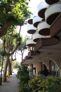 a building with balconies on the side of it at Hotel Flora in Bellaria-Igea Marina