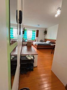 a room with a room with a bed and a room with a room at Albergo Condotel - AB Enterprise in Baguio