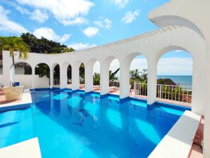 a swimming pool with a view of the ocean at Villas Paradise in San Francisco