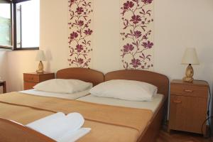 Postel nebo postele na pokoji v ubytování Apartments Petrada