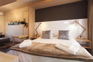 מיטה או מיטות בחדר ב-Akanani Apartments