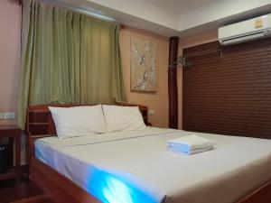 Postel nebo postele na pokoji v ubytování Ben Guesthouse