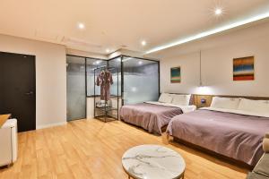 Postel nebo postele na pokoji v ubytování Brown Dot Hotel Jeonggwan