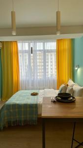 Voodi või voodid majutusasutuse BAYHOUSE - Уютные апартаменты в микрорайоне Жетысу 4 toas