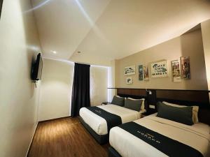 Postel nebo postele na pokoji v ubytování Monaco Hotel + 30 fotografií