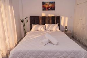 Postel nebo postele na pokoji v ubytování Minodoras Guesthouse
