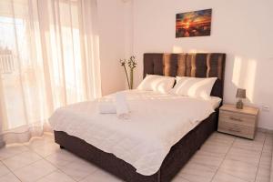 Postel nebo postele na pokoji v ubytování Minodoras Guesthouse