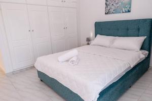 Postel nebo postele na pokoji v ubytování Minodoras Guesthouse