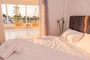 Postel nebo postele na pokoji v ubytování Minodoras Guesthouse