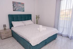 Postel nebo postele na pokoji v ubytování Minodoras Guesthouse