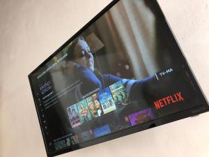 a television screen with a netflix movie on it at Bleu Downtown in Campeche
