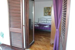 Postel nebo postele na pokoji v ubytování Apartments Petrada