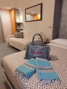 a hotel room with two bags on a table at Nido al Mare in Bonassola +65 photos