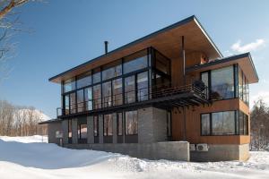 a house in the snow in the winter at Sena in Niseko