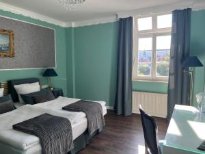 Postel nebo postele na pokoji v ubytování Rein Klassik Hotel