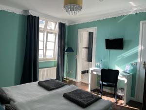 Postel nebo postele na pokoji v ubytování Rein Klassik Hotel