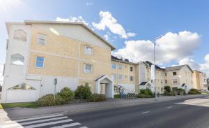 a row of apartment buildings on a city street at Your Lapland Sauna Stay in Rovaniemi