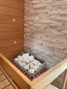 a box of white donuts sitting in a sauna at Your Lapland Adventure Base in Rovaniemi