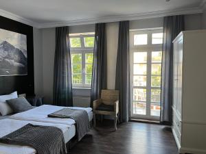 Postel nebo postele na pokoji v ubytování Rein Klassik Hotel