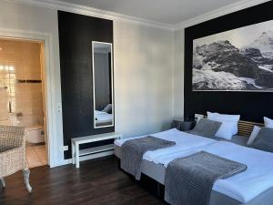 Postel nebo postele na pokoji v ubytování Rein Klassik Hotel