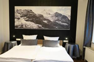 Postel nebo postele na pokoji v ubytování Rein Klassik Hotel